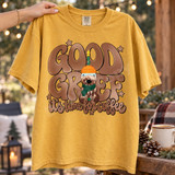 Good Grief It's Time For Coffee DTF transfer with cartoon drizzle coffee cup character wearing an orange beanie and green scarf, topped with a candy cane bird, in retro bubble lettering with stars Shown on a Mustard t-shirt.