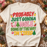 Probably Just Gonna Jingle Some Of The Way Im Tired Christmas DTF transfer in stacked polka-dot varsity lettering with hand-drawn ornaments, bell, candy cane, stocking, stars, and mini Christmas trees Shown on a Ivory t-shirt.