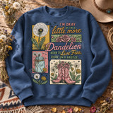 Boho western DTF transfer with dandelions, pink roses, mason jar bouquet, and pink cowboy boots around a dandelion-themed quote Shown on a Indigo Blue crewneck sweatshirt.
