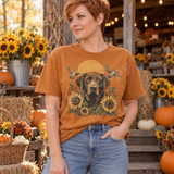 Chocolate Labrador retriever DTF transfer with blooming sunflowers, flying doves, and a glowing orange sunrise Shown on a Yam t-shirt.