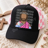 Make Jesus Famous DTF Transfer | Faceless Jesus Patchwork Robe Faith Design, colorful faceless Jesus illustration in a patchwork robe with repeated “Make Jesus Famous” lettering displayed on a black and pink trucker cap