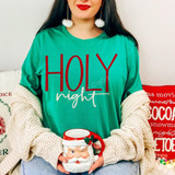Holy Night DTF Transfer | Christmas Holiday Design, red and white “Holy night” lettering displayed on a green shirt in a cozy Christmas scene