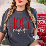 Holy Night DTF Transfer | Christmas Holiday Design, red and glittery white “Holy night” lettering displayed on a charcoal gray T-shirt in a cozy Christmas setting.