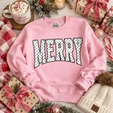Merry Polka Dot DTF Transfer | Varsity Letters Christmas Design, white varsity-style “MERRY” lettering with black polka dots displayed on a pink sweatshirt in a festive Christmas setting.