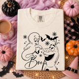 Casper-style ghost nose-booping a goofy snowman character with Boop script, bats and snowflakes, outline Halloween DTF transfer on cream shirt