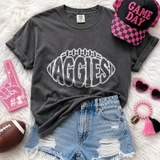 Aggies football outline DTF transfer in white hand-drawn lettering shaped like a football on a dark shirt