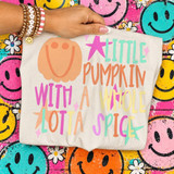 Little Pumpkin With A Whole Lotta Spice DTF Transfer | Retro Fall Design, colorful retro fall pumpkin and playful lettering printed on a white shirt, displayed against a vibrant smiley-face background