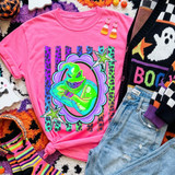Green bug king villain portrait in a leopard and rainbow striped scalloped frame DTF transfer on a pink shirt