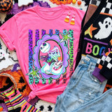 Spooky Movie Characters DTF Transfer Collection | Retro Leopard Halloween Designs, colorful Halloween graphic featuring a playful skeleton character, stars, and retro leopard-print accents displayed on a bright pink sweatshirt
