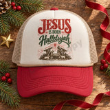Jesus Is Born Hallelujah DTF Transfer | Vintage Nativity Christmas Design, vintage red and green “Jesus Is Born Hallelujah” nativity artwork displayed on a cream and red trucker hat amid festive Christmas greenery and ornaments.