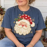 Cheerful Santa Claus face DTF transfer with fluffy white beard, red polka-dot hat, holly berries, and gold star accents Shown on a Mystic Blue t-shirt.