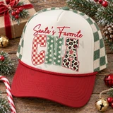 Santa's Favorite CNA DTF Transfer | Christmas Nursing Assistant Design, festive red and cream trucker hat featuring a colorful “Santa’s Favorite CNA” design with holiday patterns, styled with Christmas greenery and ornaments.