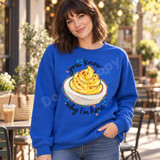 You Know Why I'm Here Deviled Egg DTF Transfer | Funny Potluck Design, colorful deviled egg illustration with playful lettering displayed on a blue sweatshirt worn by a woman