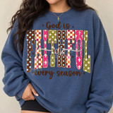God Is Faithful In Every Season DTF transfer with patterned block letters in brown, pink, cream and olive boho faith design Shown on a Indigo Blue crewneck sweatshirt.
