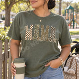 MAMA DTF transfer in block letters with checkerboard, camo, leopard, and polka dot patterns and cream bow accents Shown on a Moss t-shirt.