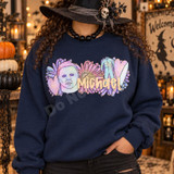 Michael Pastel Horror Mask DTF Transfer | Retro Daisy Halloween Design, pastel Michael Myers mask and retro daisy Halloween graphic displayed on a navy sweatshirt