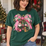 Christmas Bow Charms DTF Transfer | Festive Plaid Bow with Holiday Charm Design, vibrant Christmas bow graphic with plaid ribbons, Santa, snowman, ornaments, and festive charms printed on a green T-shirt.