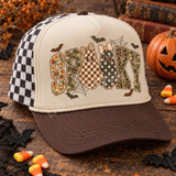 SPOOKY lettering DTF transfer with floral, camo, and leopard print fill, bow-topped checkered and polka-dot ghost characters, bats, and spiderwebs Shown on a khaki tan front panel, dark brown bill, black-and-white checkered mesh trucker hat.