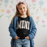 MINI varsity letters DTF transfer in mixed zebra, polka dot, leopard, and checkered print on a black kids shirt