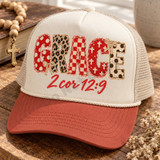 GRACE DTF transfer in mixed red, cream, and leopard print applique-style letters with bows and a red script 2 Cor 12:9 Bible verse underneath Shown on a cream foam front panel with terracotta bill and oatmeal mesh back, cream rope trucker hat.