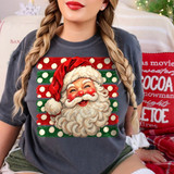 Hand-painted smiling Santa face DTF transfer with red and green polka dot stripes on a grey shirt