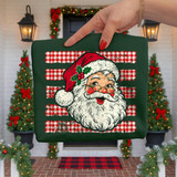 Retro distressed Santa Claus face DTF transfer with round glasses and holly, over red and white buffalo plaid stripes