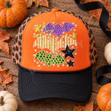 Three whimsical textured bats DTF transfer with purple polka dot, orange striped, and green star patterns surrounded by scattered stars and dots in a distressed Halloween screen-print style Shown on a Bright Orange front panel, black bill and rope, leopard mesh back trucker hat.