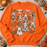 Boo Yall Trick or Moo Highland cow ghost Halloween DTF transfer collage with leopard print pumpkins, bats, and spiderwebs Shown on a Safety Orange crewneck sweatshirt.