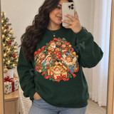 Whimsical nativity scene DTF transfer featuring the three wise men, Mary and Joseph, a baby angel, and baby Jesus nestled inside glittering Christmas gift boxes with ribbons, holly, and stars Shown on a Forest crewneck sweatshirt.