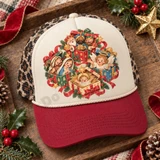 Whimsical nativity scene DTF transfer featuring the three wise men, Mary and Joseph, a baby angel, and baby Jesus nestled inside glittering Christmas gift boxes with ribbons, holly, and stars Shown on a cream front panel with deep red bill and leopard mesh back trucker hat.