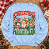 Christmas Hallelujah DTF transfer featuring a clothesline of ugly Christmas sweaters with a snowman, Santa, and reindeer, fairy lights, plaid bows, and arched lettering Shown on a Light Blue crewneck sweatshirt.