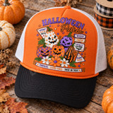 Halloween Patch DTF transfer featuring hand-painted folk-art jack-o'-lantern pumpkins in stars, checks, polka dots, and stripes with wooden sign accents and daisies Shown on a orange front panel / black bill / white mesh back trucker hat.