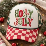 Holly Jolly Christmas DTF transfer in bold bubble letters with mixed leopard print, checkerboard, candy stripe, polka dot, and Christmas tree patterns Shown on a cream front panel with red and cream checkered bill and green and cream checkered mesh back trucker hat.