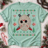 Hockey-mask skull DTF transfer in faux knit-sweater style with red scratch marks and crossed machetes, surrounded by holiday hearts, snowflakes, and trees Shown on a Seafoam t-shirt.