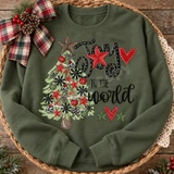 Joy to the World Christmas DTF transfer with hand-drawn tree decorated in red and leopard-print ornaments, bows, stars, and a barn-style star topper Shown on a Military Green crewneck sweatshirt.