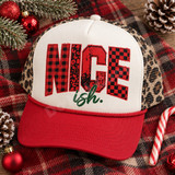 Nice-ish Christmas DTF transfer with varsity-style red buffalo plaid, leopard, distressed, and checkerboard lettering and green brush-script ish. text Shown on a white foam front, red bill, leopard print mesh back trucker hat.