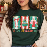 Oh Come Let Us Adore Him Christmas DTF transfer with scalloped holiday-striped frames featuring a red bow, decorated tree, and angel, above bold multicolor lettering Shown on a Forest crewneck sweatshirt.