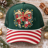 Christmas patchwork bow DTF transfer with red polka-dot cross, gold glitter trim, tiny tree patches, and 'Oh come let us adore Him' script lettering with gold snowflakes Shown on a forest green front panel with red and white striped bill and white rope trucker hat.
