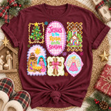 Jesus Is The Reason for the Season Christmas DTF transfer with nativity scene, Christmas tree, stained-glass church, cross, and angel panels in pastel sticker-sheet style Shown on a Wine t-shirt.