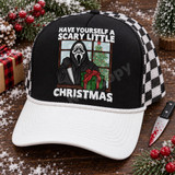 Have Yourself a Scary Little Christmas DTF transfer with Ghostface-style killer holding a knife and wrapped present at a snowy window with Christmas tree Shown on a black foam front, white bill, black-and-white checkered mesh back trucker hat.