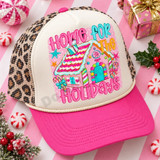 Home For The Holidays DTF transfer with colorful bubble lettering and a candy-coated gingerbread house on a pink polka-dot background Shown on a ivory front panel, hot pink bill, cream rope, leopard print mesh back trucker hat.