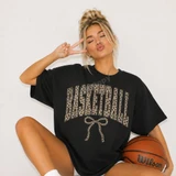 Basketball DTF transfer with arched leopard print lettering and a leopard print bow on a black oversized tee