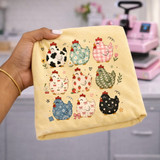 Patterned chicken DTF transfer featuring nine chickens in cow print, gingham, daisy, cherry, strawberry, ivy, paisley, and star designs