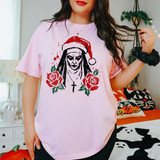 Demon nun horror character wearing a Santa hat DTF transfer with red roses and a cross necklace