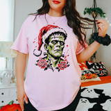 Green flat-top horror monster with neck bolts wearing a Santa hat DTF transfer with red roses