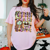 Nightmare Before Christmas DTF transfer with skeletal couple, crescent moon, and stars on a retro orange and purple striped background