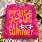 Praise Jesus All Summer DTF transfer in retro orange and hot pink bubble lettering with black-and-white spotted star accents Shown on a Heliconia crewneck sweatshirt.