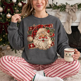 Rustic patchwork Santa face DTF transfer with plaid hat, burlap texture, and holly accents on a grey sweatshirt