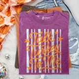 Talk Turkey To Me Thanksgiving DTF transfer with orange script lettering, stars, and vertical stripes on a purple shirt