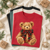 Christmas teddy bear DTF transfer with hand-painted brown bear wearing a tartan plaid bow on a red shirt
